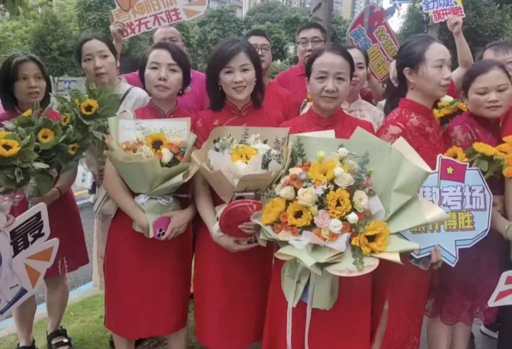 Parents waiting outside with sunflowers during the Gao Kao