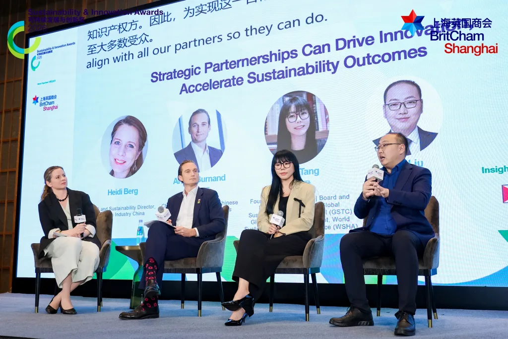 Real-time Chinese and English captions displayed during a multilingual corporate presentation in Shanghai
