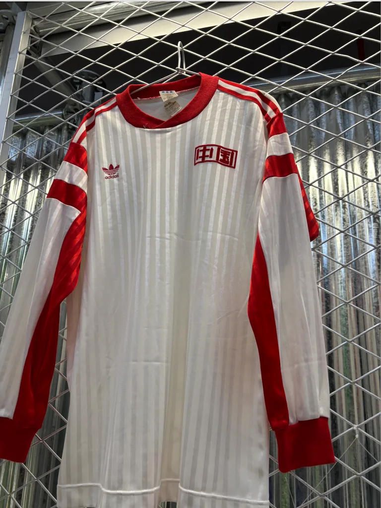 Retro football jerseys displayed at Adidas World Cup event in Shanghai, Team China
