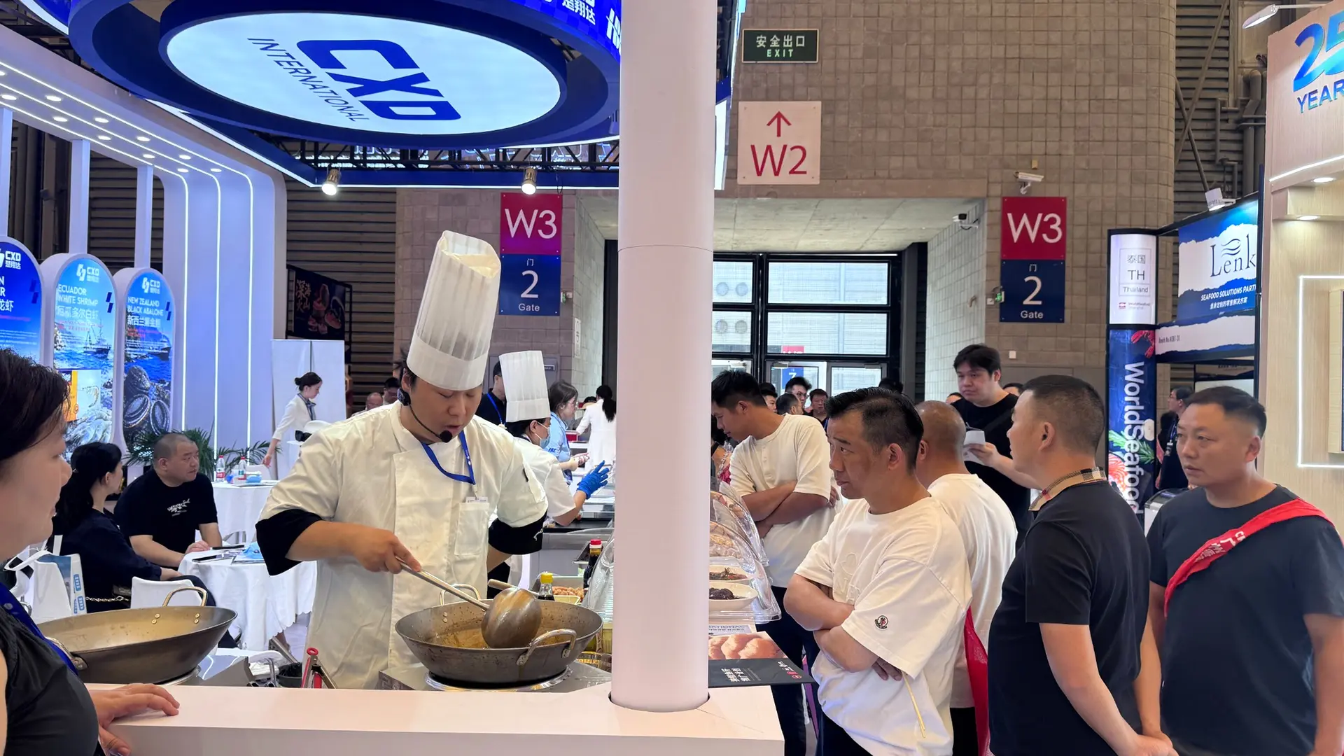 Branded seafood product display prepared for visitor tasting at an exhibition booth in Shanghai.