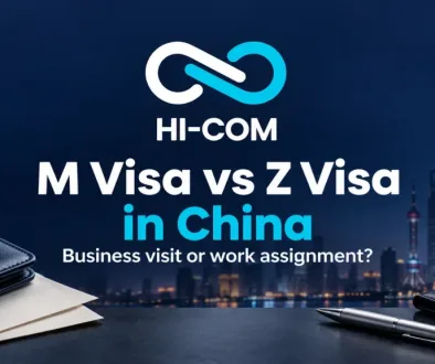 HI-COM guide to M and Z visas in China, with a centered logo, document folders and an illustrative Shanghai skyline.