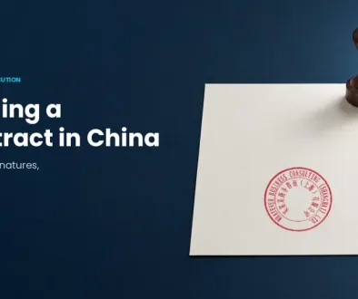 Signing a contract in China: chops, signatures and authority, with a wooden stamp, pen and real company-seal example on a document.